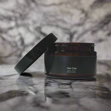 Load image into Gallery viewer, Hair Clay sitting on marble table